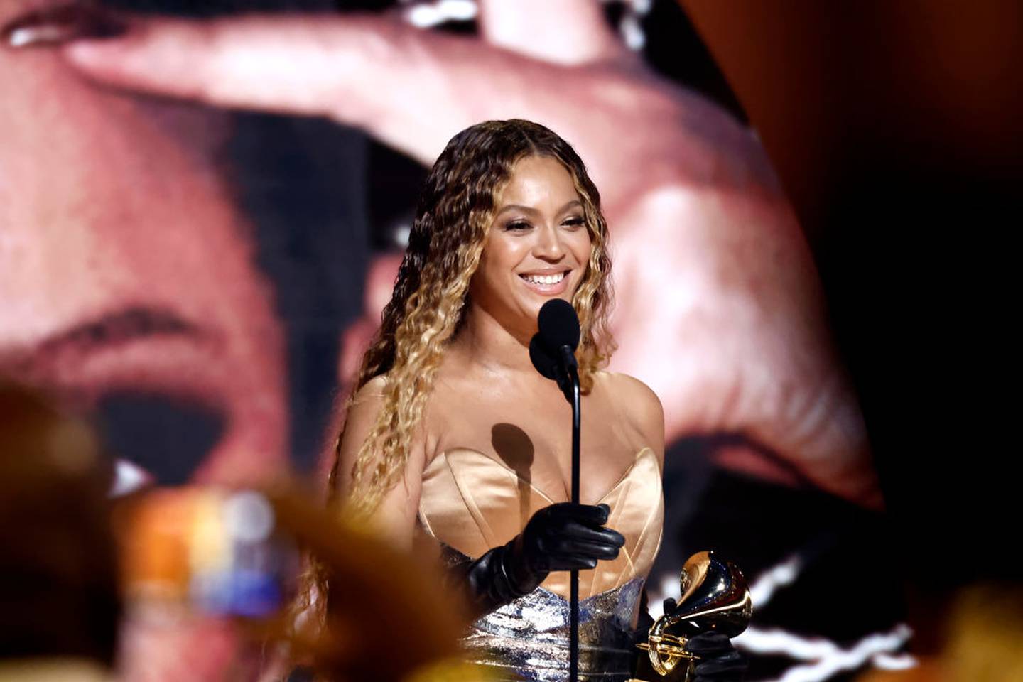 Beyonce receives a Grammy Award on stage.