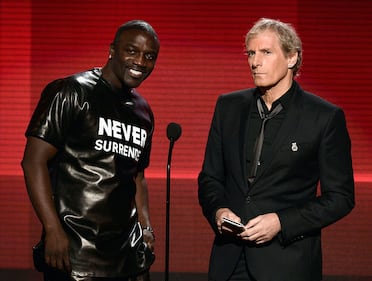 LOS ANGELES, CA - NOVEMBER 24:  Singers Akon (L) and Michael Bolton speak onstage during the 2013 American Music Awards at Nokia Theatre L.A. Live on November 24, 2013 in Los Angeles, California.  (Photo by Kevin Winter/Getty Images)